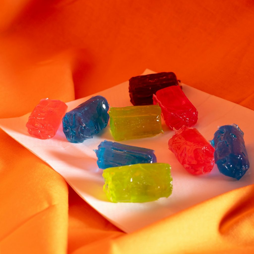 A bunch of gummy bears sitting on a plate